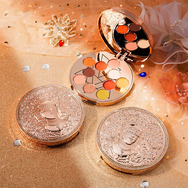 Goddess of Luck 10-color waterproof eye shadow palette with elegant packaging on glittery background.