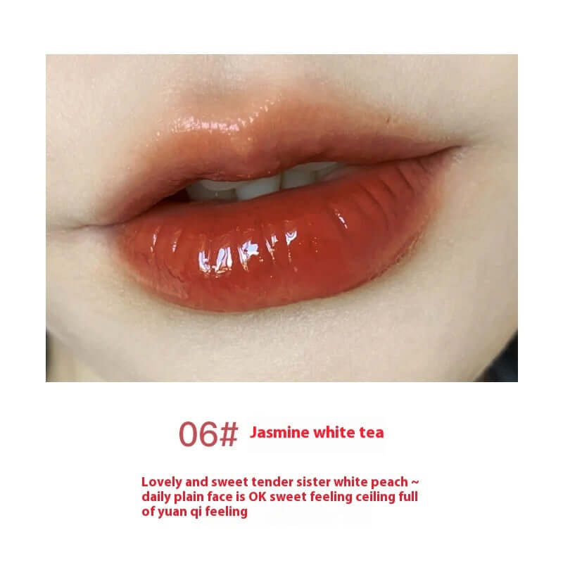 Jasmine white tea lip gloss applied on lips, showcasing a glossy, moisturizing finish for a sweet and tender look.