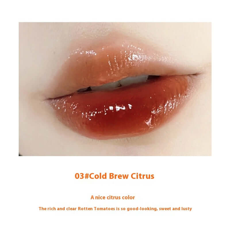 Close-up of lips wearing 03# Cold Brew Citrus lip gloss, showcasing a rich, lustrous citrus color.
