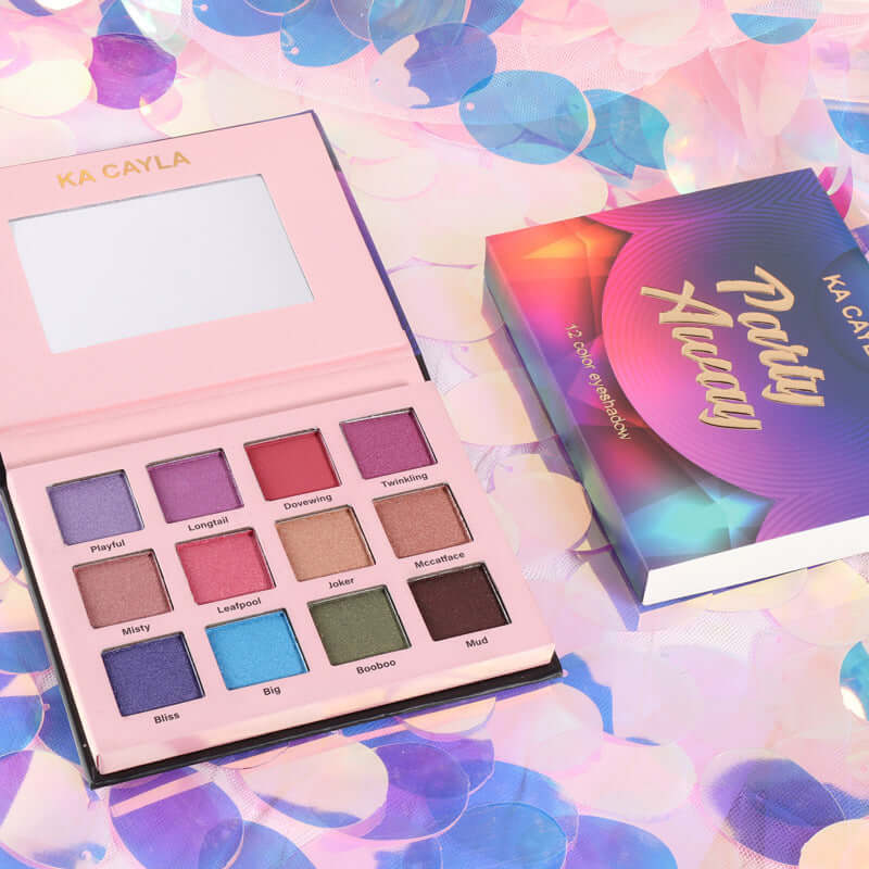Fashion Creative 12 Color Eye Shadow Palette open, featuring vibrant shades on a colorful background.