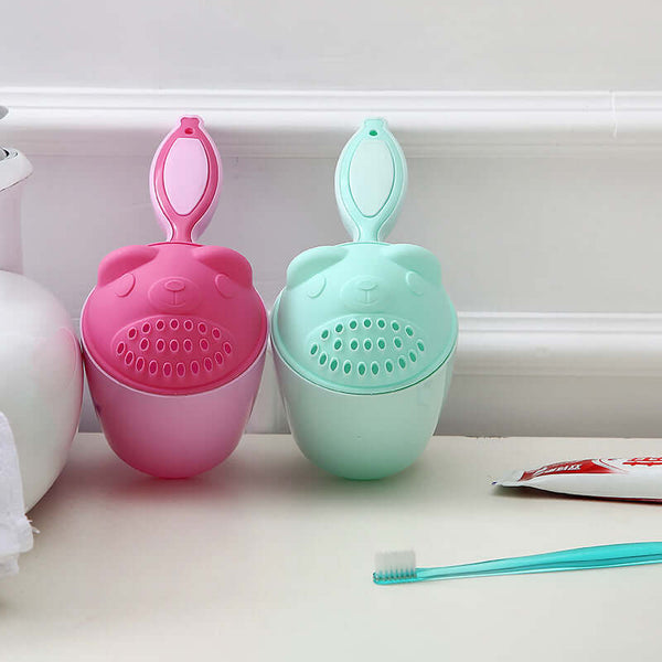 Colorful baby shampoo cups in pink and green for easy hair washing during bath time.