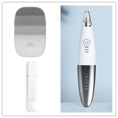 Cleansing instruments set for skincare featuring a facial brush, mist spray, and vacuum tool in white and silver.