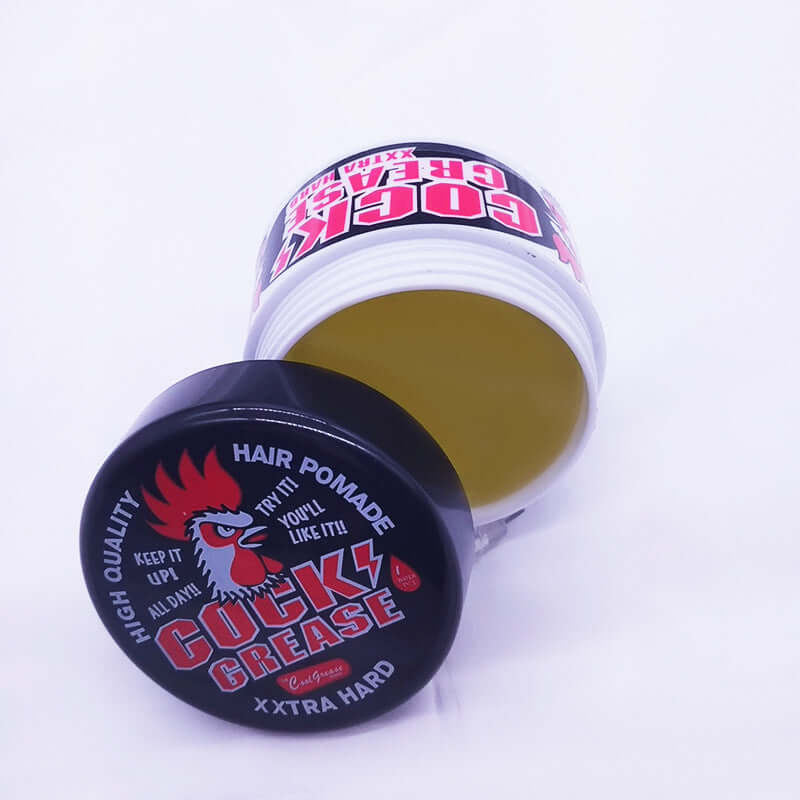 Cock Grease Hair Pomade jar with yellow paste for strong hold and styling, featuring bold rooster logo.