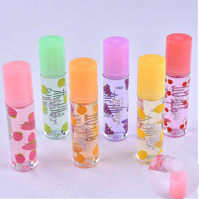 Colorful assortment of transparent lip glosses in fruity flavors, featuring a moisturizing formula in portable tubes.