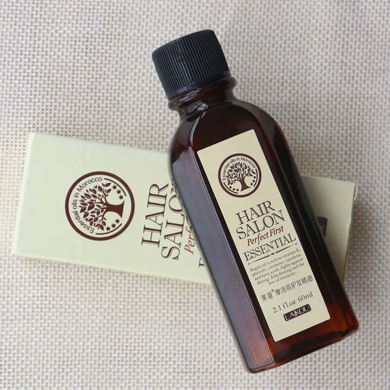Bottle of Hair Salon Perfect First Essential Oil for healthy hair, 60ml, on a light background.