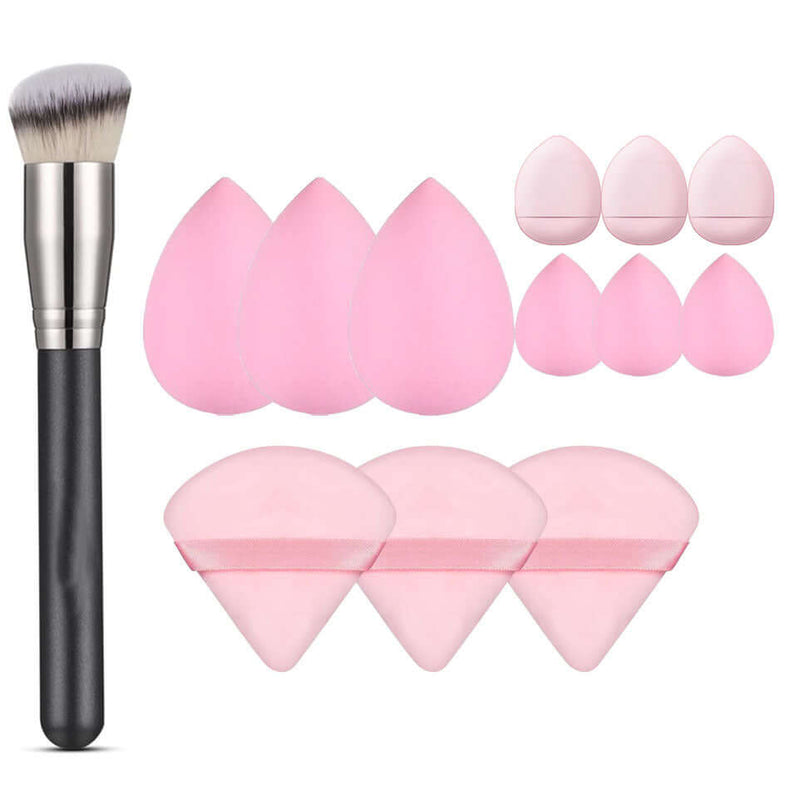 Face wash skin care mini cosmetic egg makeup set with pink beauty sponges and a brush.