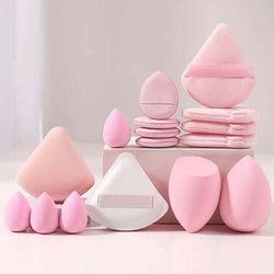 Pink cosmetic egg makeup set including various beauty sponges and powder puffs for face wash and skin care.