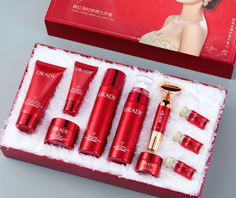 High-end skin care products set in red packaging, including facial cleanser, toner, essence, and creams.