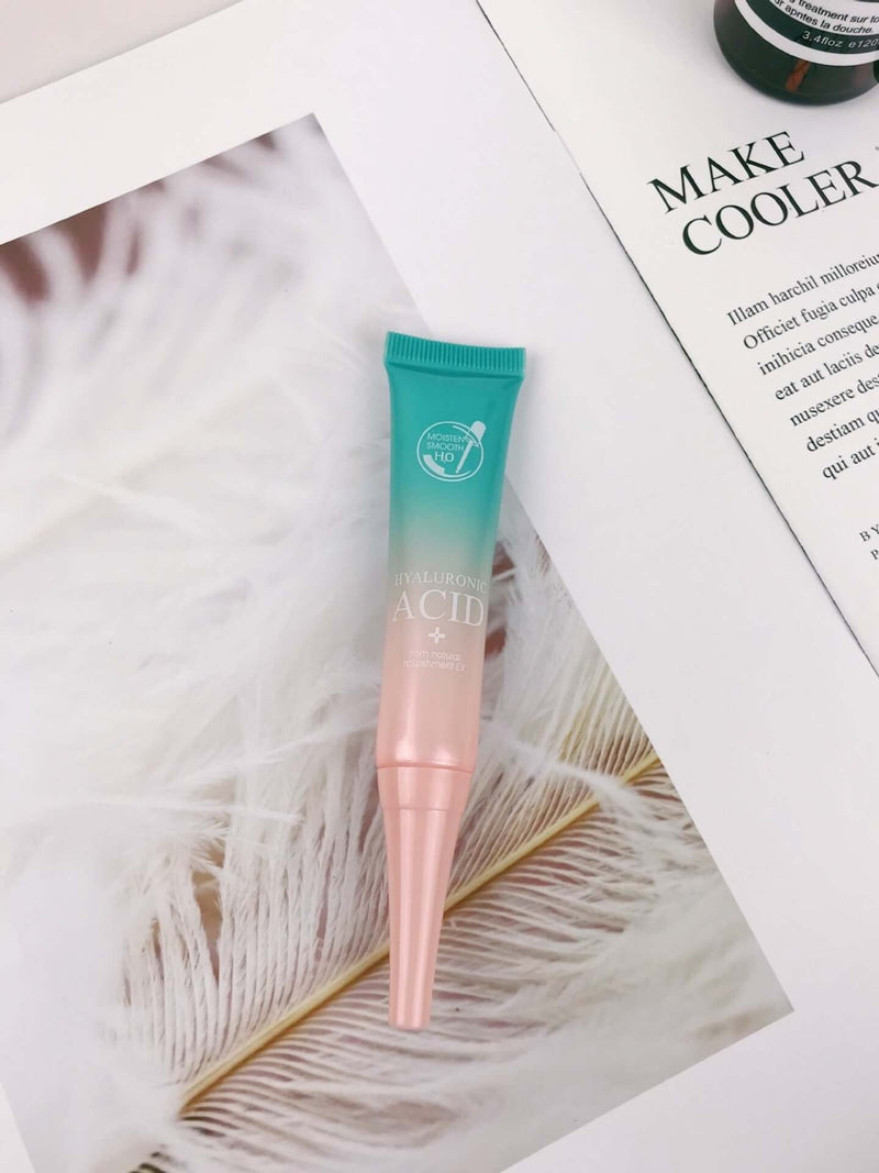 Hyaluronic Acid facial serum in a tube on a magazine page, ideal for moisturizing and skincare routines.