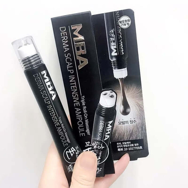 Hand holding MBA Derma Scalp Intensive Ampoule showcasing the product and packaging for scalp treatment.