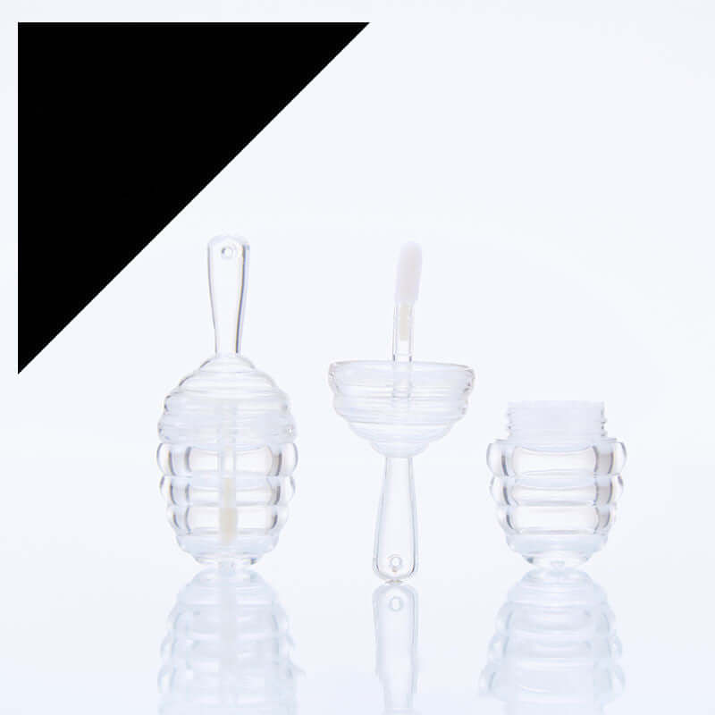 Clear mini bee fang honeycomb lip gloss tubes with applicators, perfect for lip glaze and cosmetic storage.