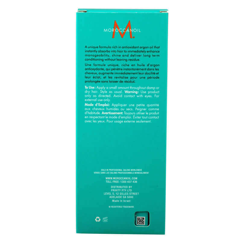 Back view of Moroccan hair oil packaging with product details and usage instructions.