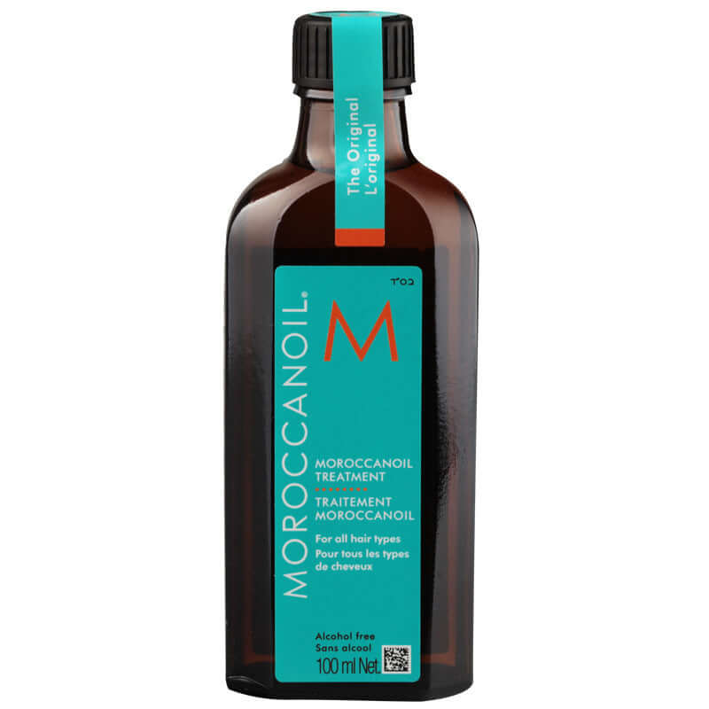 Moroccan hair oil treatment bottle for all hair types, featuring a sleek design and vibrant branding.