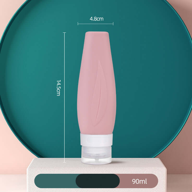 Portable pink silicone shampoo bottle with dimensions 14.5cm x 4.8cm, perfect for travel and shower use.