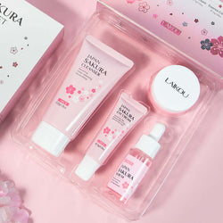 Sakura Skin Care Set showcasing cleansing, eye cream, essence, and face cream in pink packaging.