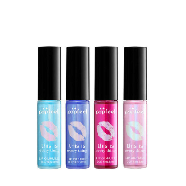 Set of four transparent lip glosses in blue, pink, and purple packaging for nourishing lips with multivitamins.