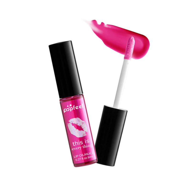 Popfeel Transparent Lip Gloss in a vibrant pink shade with applicator, enriched with multivitamins for nourishing lips.