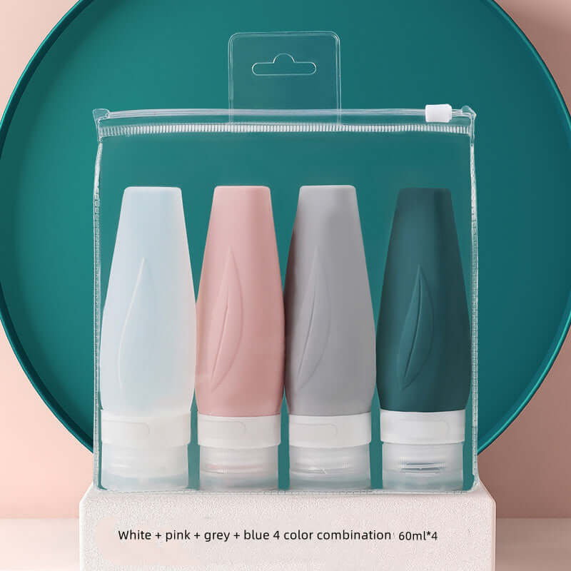 Portable silicone shampoo bottles in white, pink, grey, and blue, perfect for travel. 60ml each, leak-proof design.