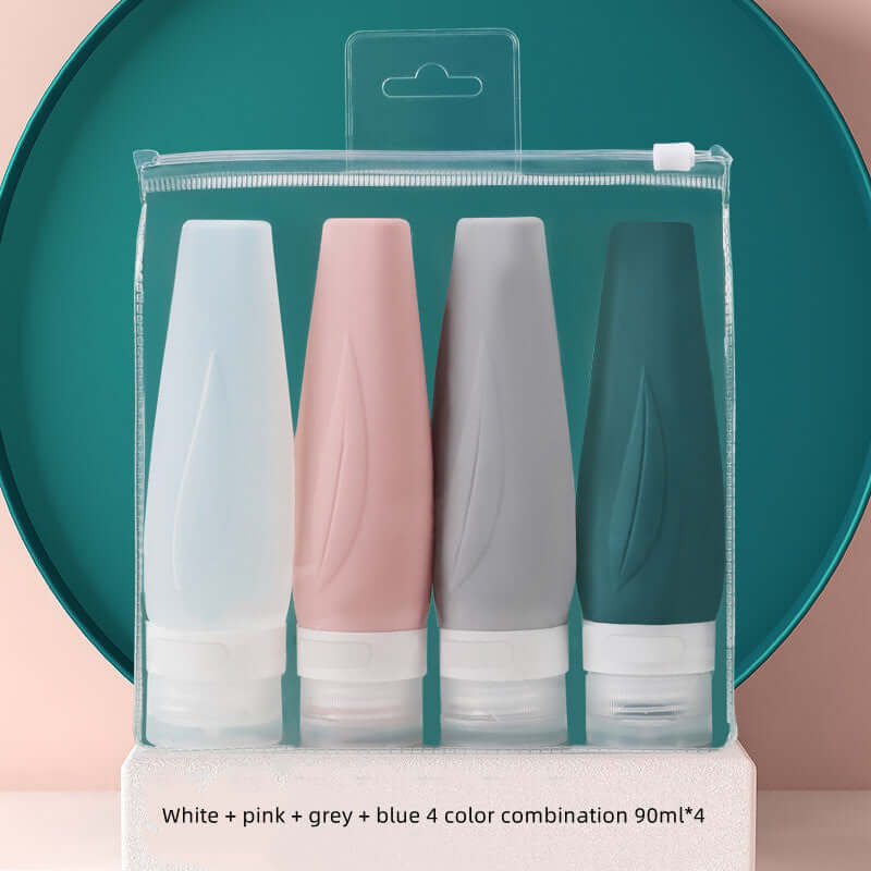 Travel shampoo set featuring white, pink, grey, and blue silicone bottles, perfect for portable convenience.