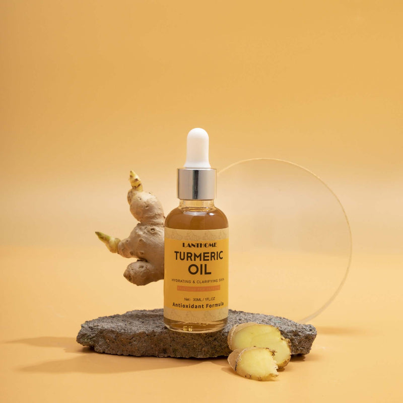 Turmeric essential oil bottle on a stone, promotes hydration and skin repair with antioxidant benefits.