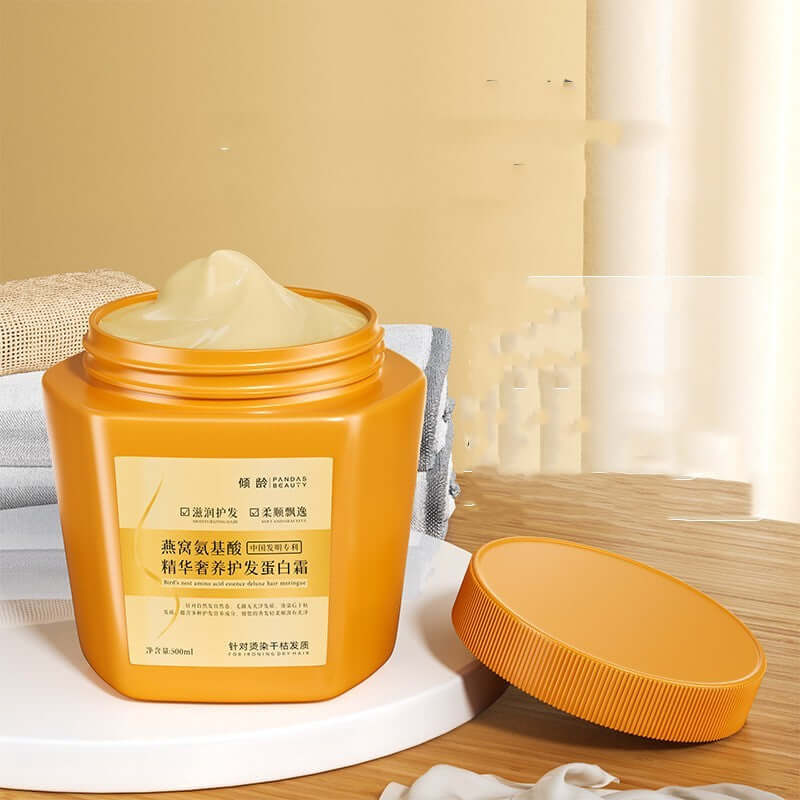 Moisturizing hair mask in a bright orange container, designed for nourishing and maintaining youthful hair.